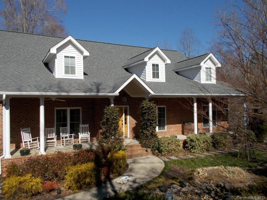 Exceptional custom all brick home with all the extras.  3.43 wooded acres with picturesque stream.  Home has 3 levels with over 5600 heated square feet.  HW floors on main – except bdrms.  Heavy crown moldings, archways, extra wide foyer, hallways & doors on main level. Rec room, play room, office, irrigation system, central vac, water filtration & softener system, 2 decks & a screen porch – too many features to list.  Impeccably maintained. Lower level would make an ideal in-law suite.