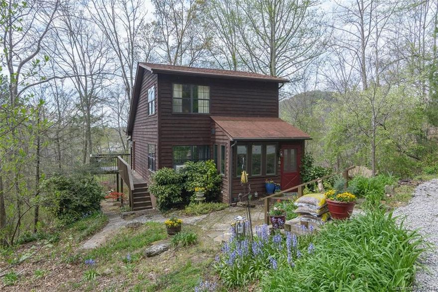 Updated Move right into this...SUPER SWEET Storybook...Ideal Vacation Rental or Second Home/Mountain Getaway!!! You must come and see the completely remodeled kitchen with granite counters, double oven, maple cabinets and matching stainless appliances!  BEAUTIFUL new maple wood flooring, new windows in sunroom , new tile in upper level master suite & new tile, toilet, sink and shower in daylight basement suite.  Enjoy the PRIVACY and fall/winter long range mountain views from the EXPANSIVE deck!