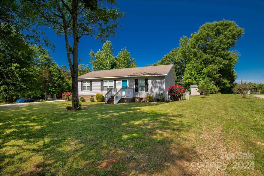 This move in ready home  sits on 1.24 acres and is only a few miles from the convenience of I-77 while still giving you the feel of Country living! Great entertaining space on the large composite back deck with plenty of counter space in the eat in kitchen. Home was upgraded prior to sellers ownership to a high pitch roof for extra curb appeal.