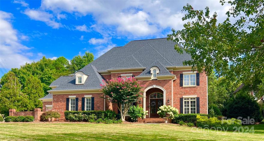 Gorgeous street presence for this all-brick custom-built Georgian style home with a sweeping front yard.  Hard to find 4 car garage offers plenty of options for storage. Spacious, flat lot with established trees and landscaping making for the perfect and private retreat with a new rear porch and room to add a pool. Flexible floorplan offers options for two offices and or a 1st floor bedroom. Kitchen boasts two large islands, built in beverage center, bar and pantry.  Enjoy your casual meals in a gorgeous room with views of the backyard through floor to ceiling windows. Upper level includes generous master suite, three bedrooms, 2 addt’l baths plus bonus room and large laundry room. 10' ceilings (1st), plantation shutters, built-in drop zone, endless windows, extensive moldings, French doors, are just a few of the special features. House is nestled between two cul-de-sacs, and close to Brem Park.  Easy walk to the Ballantyne Bowl.