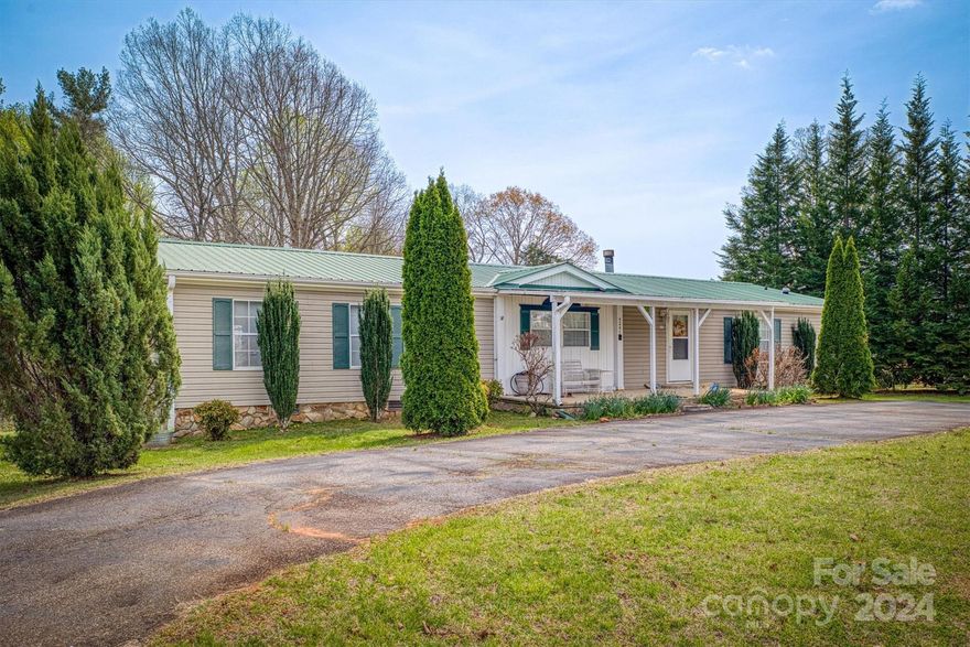 Welcome to 4247 Chambers Chapel Road, Morganton! Nestled in a serene location, this spacious doublewide manufactured home boasts a split bedroom plan, offering privacy and comfort for all. As you enter, you'll be greeted by a charming circle paved driveway, adding convenience and curb appeal. Inside, the large open living space provides ample room for gatherings and relaxation, while a bonus room offers versatile options for work or play. With its well-designed layout and inviting atmosphere, this home is perfect for creating lasting memories with family and friends. Don't miss the opportunity to make this your dream home!