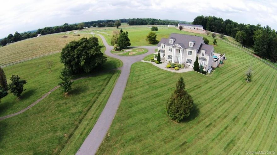 131ac European-Styled Country Estate w/5130'+SF Main House, 1900+SF cabin, 9 Stall, 40x120 barn w/covered runs! Salt water pool,outdoor arena,2.5ac private stocked pond. Aggressively priced and sold "As-Is".Main home quality construction includes 20' coffered ceiling LR, coved ceilings, arched openings,columns,ext. molding, cherry inlaid & herringbone hardwoods, marble, sculptured ceilings & more!Lg established pastures. Easily access to Mooresville,Charlotte, and Winston Salem.SEE MLS 3117985