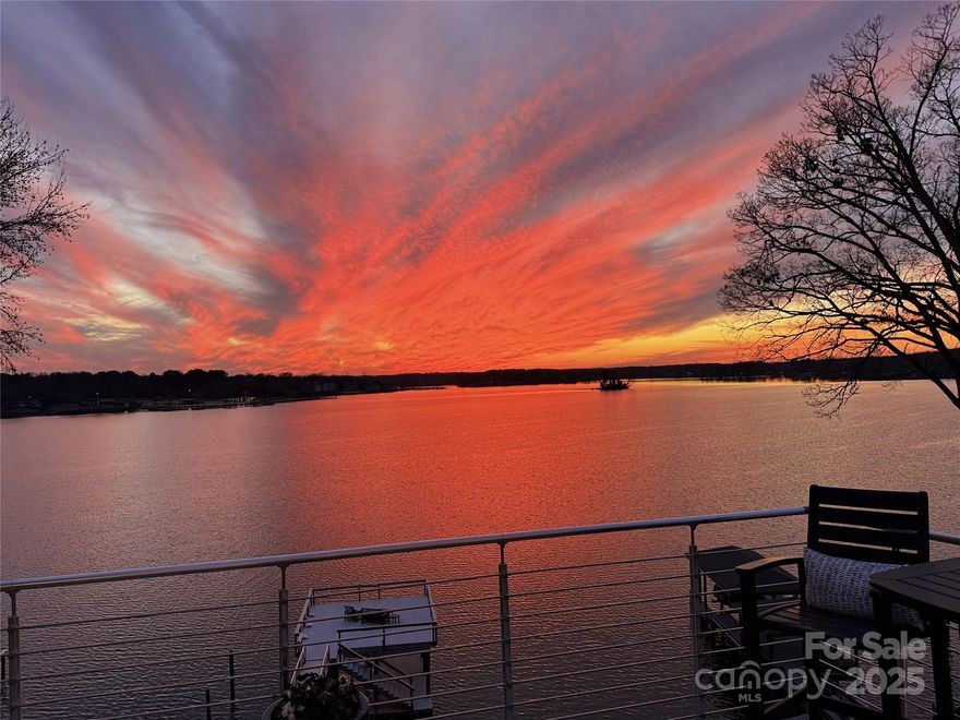 The water views & sunsets from this luxurious custom home will take your breath away. This modern design home takes full advantage of the stunning main channel views of Lake Wylie with 126 ft of shoreline. The open floor plan on the main floor unites the kitchen, living room & dining areas. 15 ft accordion door opens onto a spacious deck. The kitchen offers a recently installed quartz island, countertops, backsplash, a Wolf gas range, a stainless hood, a built-in Miele coffee maker, a Wine nook & scullery right off the kitchen, and a huge walk-in storage space. The primary suite has another breathtaking lake view with sliding doors onto the balcony. The garage is heated & cooled and includes a pet bathing station. The lower level showcases a family room, kitchenette,  2nd laundry rm, bathroom, steam shower & workstation. The lower terrace will be a favorite gathering space with a fabulous pool, covered patio, & lake access from the balcony dock with a boat lift.