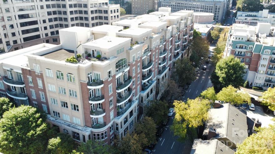 This urban oasis will wow you!  Located in the iconic 400 North Church condominium building, city life doesn’t get any better than this.  The 4th Ward location is highly desired for it’s quiet walkability and friendly tree lined streets.  Every corner of this home has been exquisitely renovated with the highest of quality materials and craftsmanship.  Designer touches are everywhere.  The vibe is sophisticated elegance.  The great room is highlighted by a wall of windows looking out over the green canopy of the neighborhood with the city buildings and lights as a backdrop.  The hardwood floors gleam.  This area is large and accommodates company easily with two access points to a wide terrace.  The kitchen features every upgrade imaginable including top line appliances, custom pantry and wine refrigerator.  The primary bedroom of this corner unit also has a bank of windows that makes this a bright retreat.  The custom closet, expansive bathroom with egg tub and walk-in shower make this ensuite a dream.  The second bedroom is located on the other end of the home for privacy.  The real treat is the large den/ office space.  Large enough for small conversation or relaxing with a good book or binge watching your favorite show.  A second balcony is accessed from this wonderful space.  Secure parking is onsite as is a storage unit.  Fitness center located on the 6th floor.  Condo blinds are on timers.  With all of this why would you ever leave?  But if you do, just lock and go with no worries.  Come take a look.