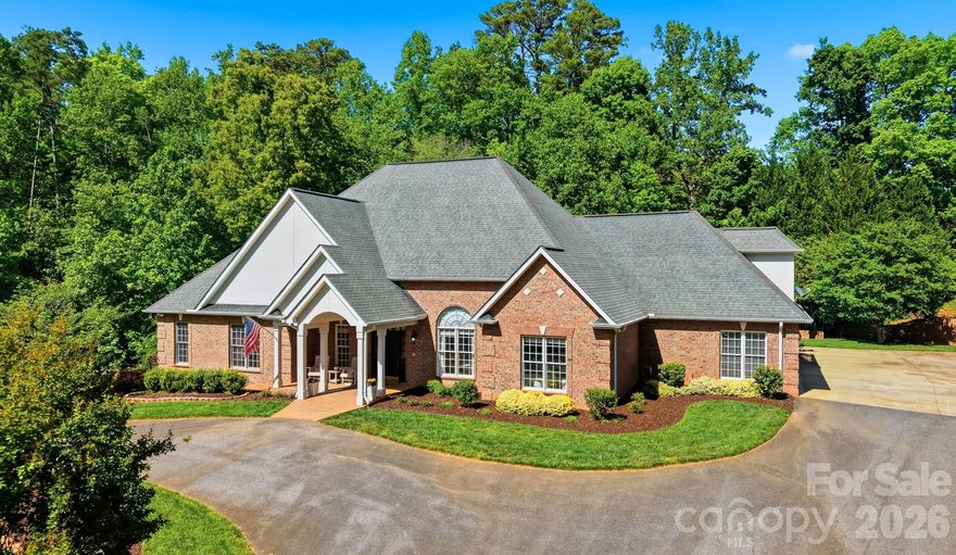 Welcome to this exceptional executive home in the highly desirable Lake Hickory Country Club community, where luxury, space, and thoughtful updates come together in one stunning property.

Situated on a 1.22-acre lot, this all-brick residence offers approximately 3,400+ square feet, featuring 4 bedrooms and 3.5+ bathrooms, designed for both comfortable everyday living and elegant entertaining.

Step inside to discover new hardwood floors throughout the home and fresh interior paint, creating a bright, cohesive, and move-in-ready feel. The spacious layout includes multiple living areas, a formal dining space, and well-appointed rooms ideal for both work and relaxation.

A standout feature is the second primary suite on the main level, complete with a roll-in shower, offering flexibility for guests, multi-generational living, or enhanced accessibility.

The primary suite has also been beautifully updated, featuring a renovated bathroom and upgraded closet, creating a true retreat with modern finishes and improved functionality.

Major mechanical updates provide peace of mind, including a new HVAC system and water heater, ensuring efficiency and reliability for years to come.

Outdoor living is just as impressive, with new tiered gardens and professionally enhanced landscaping, creating a private, picturesque setting perfect for entertaining or enjoying quiet evenings at home.

Located in NW Hickory within the sought-after Lake Hickory Country Club area, this property offers access to one of the region’s premier communities, known for its established homes, scenic surroundings, and convenient proximity to shopping, dining, and recreation.

This is a rare opportunity to own a turnkey executive home with significant upgrades in one of Hickory’s most desirable locations.