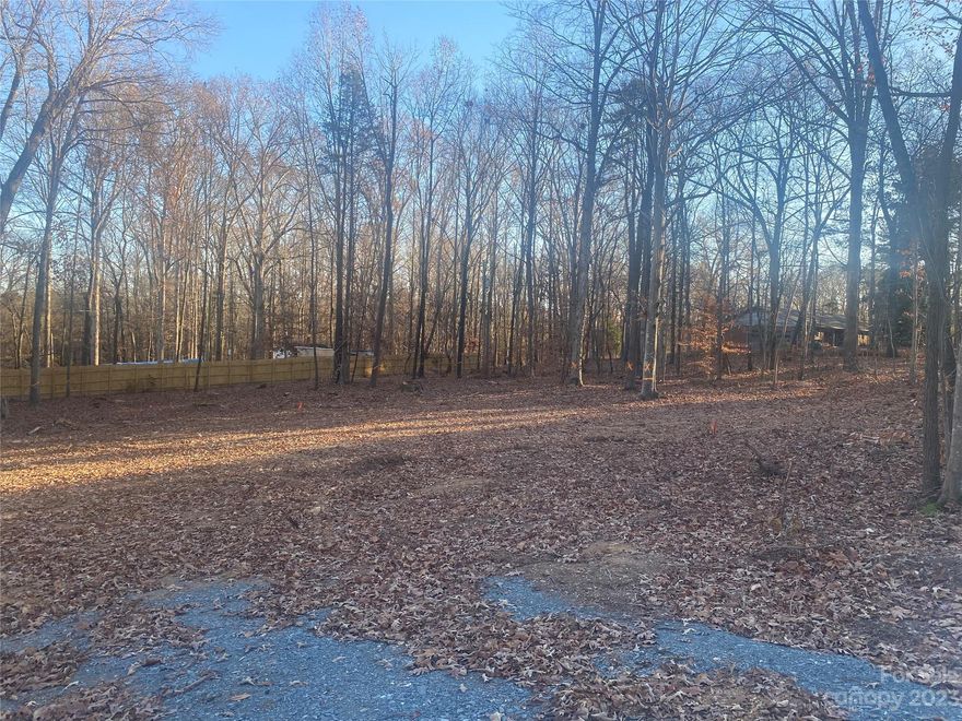 Rare opportunity to secure beautiful acre plus sanctuary in a lovely established neighborhood featuring large lots, convenient to four golf courses, shopping and I-485. Home site has been cleared and is surrounded by hardwoods. Select your own builder with no building timeframe requirements. Current-owner survey available upon request. Located in sought-after Union County yet convenient to Mint Hill amenities.
