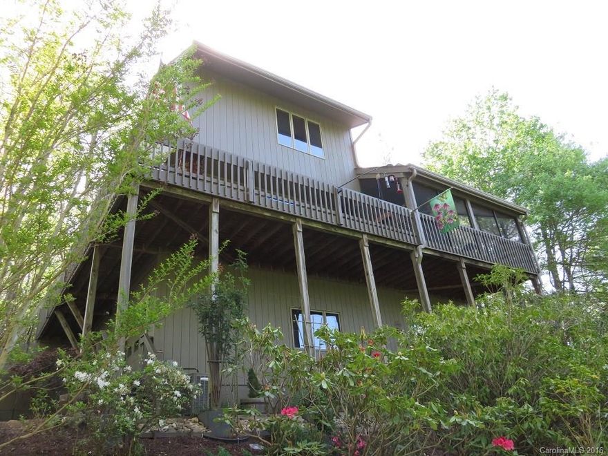 Enjoy Mountain views, seasonal lake views and privacy from this Impeccably Maintained Mountain home situated on 1.4 acres.  Beautiful Hickory floors in the common areas of this Light & Bright Open floor plan & updated kitchen with granite counter tops. Enjoy gardens and natural surroundings from the lovely screened porch or large open deck. Nice Lower Level suite to accommodate guests.  4 Lakes, Clubhouse, tennis, pickleball, hiking trails, golf, pool. 1st time buyer to Connestee pays $8000 UF