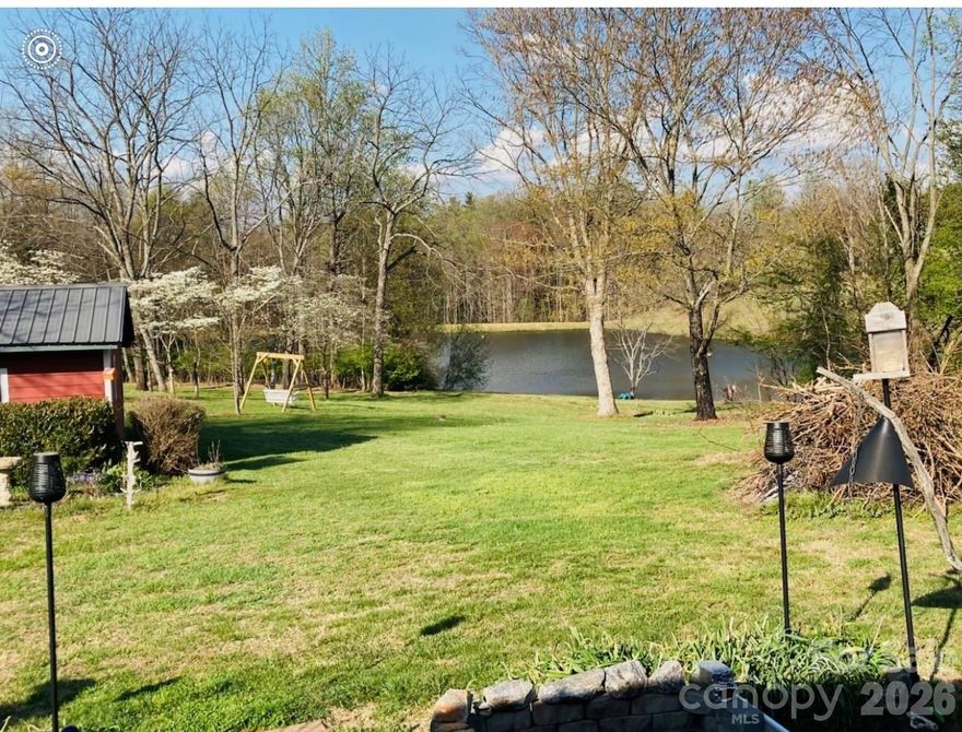 Well-maintained brick home on 5 acres in Moravian Falls overlooking a 7-acre lake. Private setting with creek along the back of the property. Features include a wood-burning fireplace, greenhouse (24’x14’), garden area, and spring-fed well. Check out the newly finished basement and bathroom downstairs, which can be used as a bonus room , bedroom , office, art studio. *see measure report for lay out All appliances convey. Includes 15 chickens. 1,000-gallon propane tank in place with approx. 400 gallons remaining to transfer at no charge with acceptable offer. Ideal for country living with usable land and scenic surroundings.