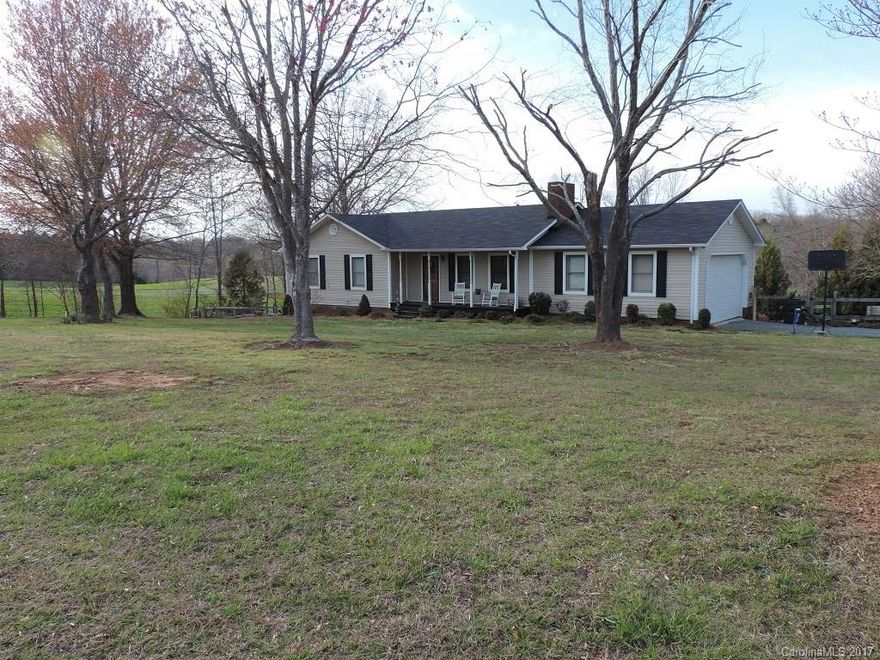 Beautiful Country living! This home has a fenced in back yard, pool with multi level decking great for entertaining, Security System, Fireplace with gas logs, battery powered lighting system for when the power goes out (will last up to 30 days on one charge) Built in safe in the basement, Bonus room in the basement could serve as a fourth bedroom with a closet, basement shop, 2 car attached garage plus much more!