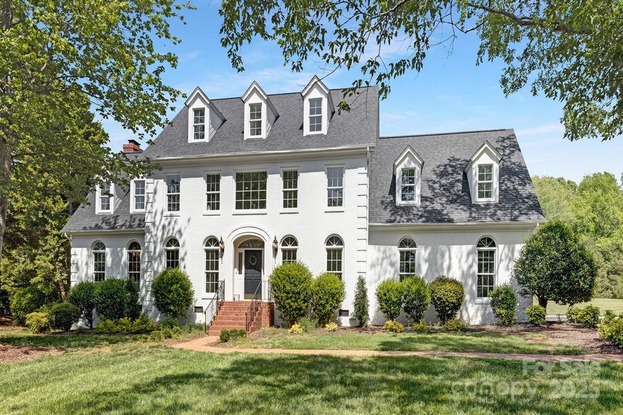 Experience luxury living at its finest in this fully renovated painted white brick home in the exclusive gated community of Walden at Providence, near Waxhaw. Tucked away on a serene 2.1-acre flat lot, this home welcomes you with a tree-lined driveway and lush landscaping, offering plenty of room for a pool. No detail has been overlooked, from the gourmet kitchen with a chef's appliance package and quartz countertops to the seamless open-concept living space that leads to a sun-soaked, oversized sunroom. A moody lounge, perfect for a bar or office, overlooks the expansive deck and yard. Upstairs, the primary suite features a spa-like bath with a walk-in shower, soaking tub, and generous closets, along with 3 additional bedrooms, 2 baths, and a cozy loft leading to a 3rd-floor bonus and flex room with walk-in closets. Minutes from top-rated schools, Blakeney, Waverly, Ballantyne Bowl, and 485, this home offers the ultimate blend of luxury and convenience.