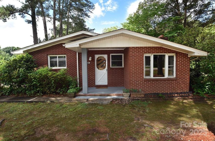 Welcome Home! Charming 2-bedroom, 2 full bath home sitting on .60 acres that back up to Rolling Hills Golf Course. Home is located in a quiet neighborhood just minutes from shopping, restaurants, & I 85. Home features freshly painted rooms updated kitchen/baths & an unfinished basement for workshop or storage. Roof 2023/2024.