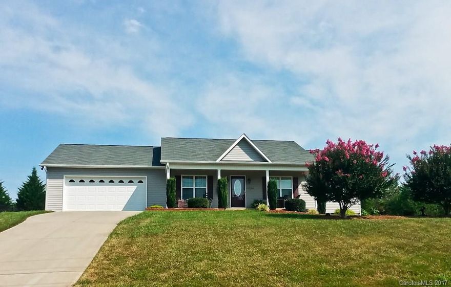 The home you deserve!! You'll love living is this custom built, quality 3 bedroom 2 bath ranch with shiny hardwood floors through out and tile in the baths. The Great vaulted ceilings, maple cabinets in kitchen and baths, walk in closets, separate laundry room and extra storage in the garage make this is perfect home. Relax on your covered front porch or invite the neighbors for a cookout in the flat, private, fully fenced rear yard.