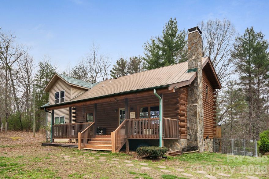 Tucked away in the scenic foothills, located in the sought after Dudley Shoals area, this beautifully maintained log home on almost 7 acres offers rustic charm and room to grow. Wake up to serene mornings on your rocking chair front porch sipping coffee as birdsong and gentle breezes welcome the day with natures beauty unfolding right before you. Inside, you’ll find a spacious, functional layout with an inviting main living area that flows seamlessly into the kitchen and dining space, ideal for both everyday living and entertaining. The kitchen has been updated with new stainless steel appliances, offering a clean, modern contrast to the warmth of the natural wood interior, plenty of storage and a breakfast bar that provides additional seating. Enjoy winter evenings gathered around the wood stove in the living room. Upstairs offers a large family room, full bathroom and two additional bedrooms with a 4th room currently being used as a home gym. Primary suite on main level with his and hers walk-in closets, a large garden tub, tiled walk-in shower, and dual vanities. Step out back on the large deck to enjoy the fenced-in backyard, perfect for pets, play, or simply relaxing in your own private outdoor space. The logs were professionally refinished in 2022 providing long term durability. Surrounded by the natural beauty of Western North Carolina, this property offers the peace and privacy buyers are looking for while still being conveniently located to Lenoir, Hickory, and the High Country. This home is full of character—and one you don’t want to miss.