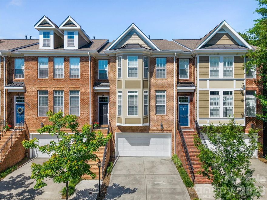 Tucked in one of South Charlotte’s most desirable gated communities, this beautifully maintained townhome offers the perfect balance of comfort, style, and convenience just minutes from The Arboretum, SouthPark, Waverly, and top-rated schools. Surrounded by mature trees and professionally landscaped grounds, the neighborhood provides a peaceful, low-maintenance lifestyle with a community pool and easy access to some of Charlotte’s best shopping, dining, parks, and medical facilities.
Inside, the home feels inviting  and thoughtfully designed. Natural light fills the open main living area, highlighting hardwood floors, detailed moldings, and custom millwork. The spacious dining area flows easily into the kitchen and living room w/ wet bar & butlers pantry, creating an ideal layout for both everyday living and entertaining. The kitchen features granite countertops, stainless steel appliances, double ovens, a gas cooktop, crisp white custom cabinetry, a large island, and custom shelving in the walk-in pantry, all overlooking the inviting family room with fireplace and flows to deck.
Upstairs, the primary suite offers a quiet retreat with tray ceilings, a custom walk-in closet, and spa-like bath. An additional en-suite bedroom provides privacy and flexibility for guests or family. Don’t miss the office nook in the large hall closet and convenient laundry closet. The lower level includes a spacious flex room with a full bath and private patio access—perfect for a guest suite, office, media room, gym, or bonus space.
Designed with long-term living in mind, the home also includes aligned closets on each floor for a future elevator option. Outdoor spaces include both an upper deck and a private, fenced lower patio surrounded by professional landscaping offering the perfect spots to relax. Elegant yet comfortable, this move-in-ready home offers refined townhome living in one of South Charlotte’s most convenient and established locations.