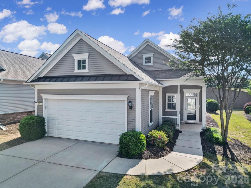 Freshly painted, cleaned and move-in ready Fox Run home in Sun City Carolina Lakes!

Step into a bright, open-concept living and dining area, elegantly accented with wainscoting and a statement chandelier. The front-facing kitchen is both stylish and functional, featuring a central island, stainless steel appliances, and a cozy breakfast nook - perfect for casual mornings or gathering while meals are prepared.

The tiled sunroom lives up to its name, surrounded by windows that fill the space with abundant natural light, creating a warm and inviting retreat year-round.

The primary suite offers peaceful backyard views and a private ensuite accessed through double doors, complete with a dual-sink vanity and a glass-enclosed shower. A spacious secondary bedroom is conveniently located near a full hall bath, making it ideal for guests.

Enjoy sunny days on the back patio with a roll-out awning, overlooking a partially fenced backyard - perfect for pets or outdoor relaxation.

Experience the exceptional lifestyle Sun City Carolina Lakes has to offer, with resort-style amenities including golf, indoor and outdoor pools, gym, tennis, pickleball, water access, social clubs, and more! And, just a golf cart ride to grocery, shopping, restaurants and medical.