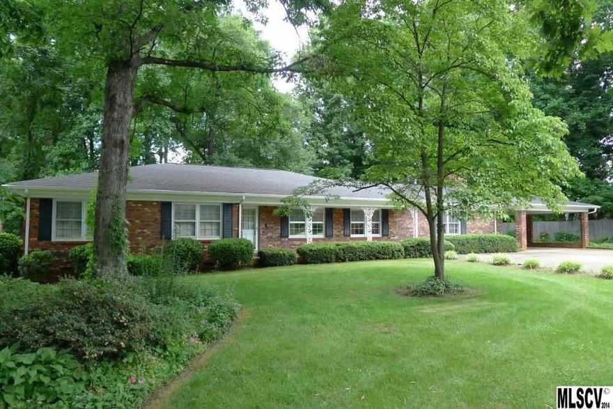 Lots of space for the price! This all-brick home offers a low maintenance exterior and no stairs to climb, plus neutral décor--you can move right in! Features include a large covered front porch leading to the foyer with double coat closets, sunny living room with space for a formal dining table, den with sliders to the rear patio and adjoining kitchen featuring a breakfast area with built-in china cabinet. Also off the kitchen, you'll find a convenient half bath, laundry room with lots of storage, and 2nd den/play room with fireplace and door to the double carport. The central hallway leads to three bedrooms, including a master suite with his/hers closets and private bath. Lushly landscaped yard with mature trees and lots of blooming perennials. Additional perks include replaced roof (2002), replaced HVAC (2009), vinyl trim, all new interior paint, neutral carpet & vinyl, and more! Priced well below tax value--don't miss it!