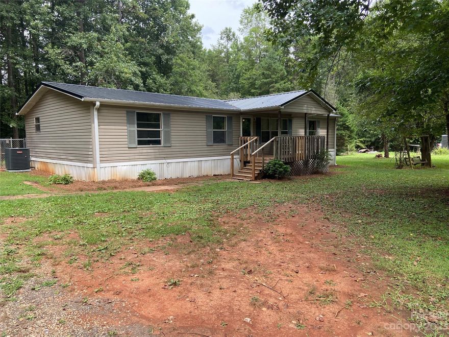 Very private country setting, with 1.39 acres. Close to High Rock Lake, and shopping off NC Hwy 8.
Major improvements have been completed, with new metal roof and Heatpump, Detached metal carport, front and rear deck.   Property sold, "as is".