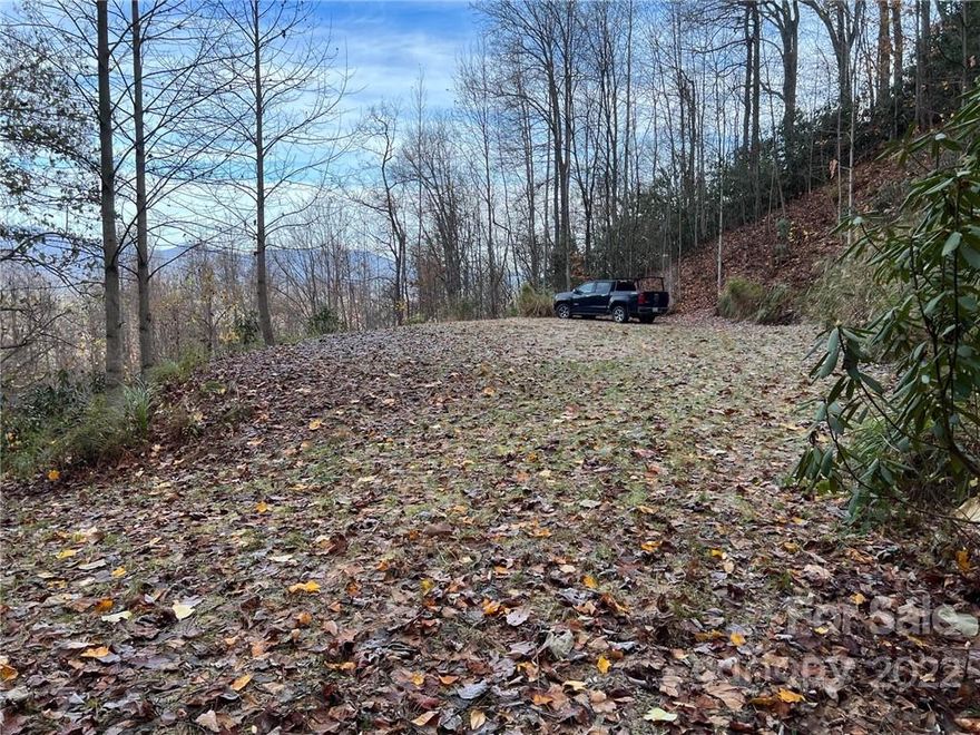 The recent price reduction makes this lot even more attractive. This particular lot is only about 1/2 mile from the Crimson Road Gate.  A rough driveway and a building pad are in place. The views of Mount Mitchell and the mountain Ranges east and west are breath-taking.  These views are phenomenal.   Old Fort now has a fine brewery with great lunch and dinner menu.  Old Fort is about 15 minutes to Black Mountain and another 15 minutes to Asheville and the Blue Ridge Parkway. Go to www.gmpoa.org to learn all about Gateway- rules, regulations, building guidelines, fees, etc.  Gateway Mountain was first established in 1982 and has 3,000 acres, a nice little lake for swimming and fishing and kayaking.  Hundreds of more acres were recently purchased for preservation forever.  Short term rentals are allowed, and we have lots of nature.  Come visit or rent a house to find out if this is just what you have been waiting for.