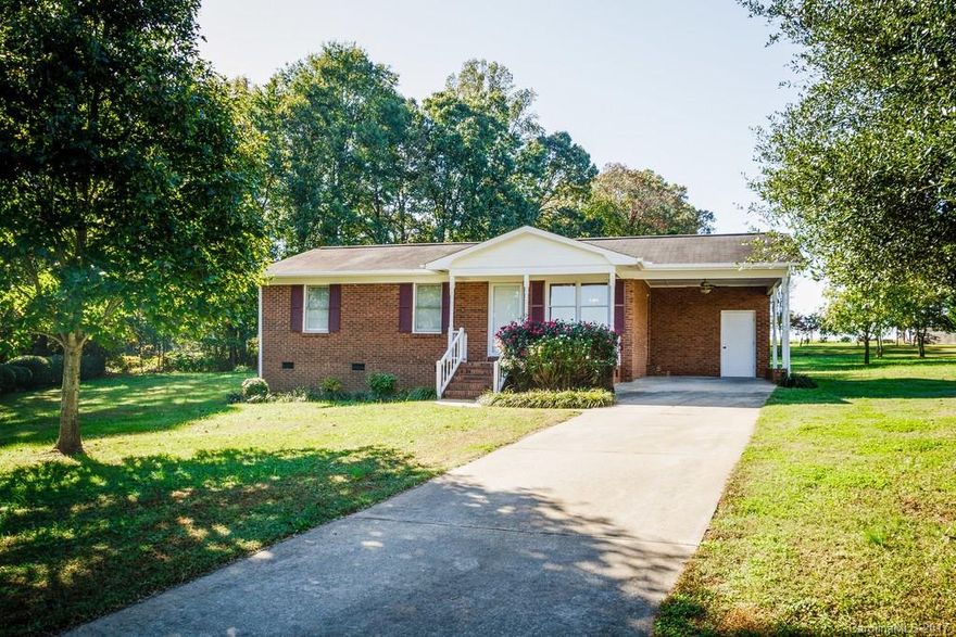 Meticulously maintained, well-loved home awaits new owners! From the covered front porch to the open living area/kitchen to the perfect deck overlooking the large back yard, this home is ideal & completely move-in ready! Quiet, cozy neighborhood convenient to many points of interest. Brand new laminate wood floor in most of home! Bathroom is beautifully upgraded w/granite countertop! Impressive walk-in closet in master BR! Ceiling fans throughout! HVAC only 4 years old!