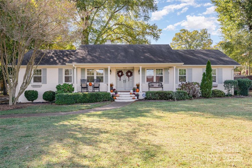 Welcome to this beautiful full brick ranch home nestled on nearly half an acre - offering the perfect blend of charm, comfort, and convenience with no HOA! Whether you’re downsizing from a larger home, seeking a property ideal for multi-generational living, or ready to settle into your forever home, this residence can accommodate your needs with ease. 

Inside the home, you’ll find three bedrooms, two bathrooms, a wood burning fireplace, and granite kitchen countertops. The living spaces are open yet cozy, creating the perfect balance for gatherings or quiet nights in. Right outside you have the covered two-car carport with a storage room, a screened-in porch, and an expansive rear deck overlooking the level, fenced backyard. A detached two-car garage with a convenient half bath and storage room adds extra functionality and can be converted into an Accessory Dwelling Unit (ADU)! 

Located just 10 minutes from Uptown Charlotte, Plaza Midwood, and NoDa, and only 20 minutes from South Charlotte, this home offers quick access to the area’s best dining, shopping, and entertainment.