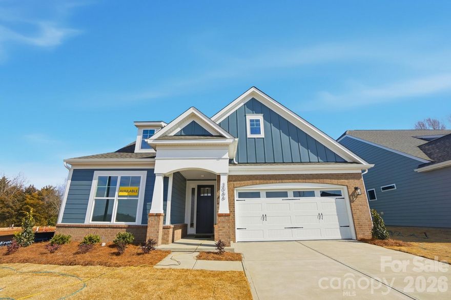Welcome to a new age-restricted community in Gastonia close to shopping, dining and other conveniences! This 1.5-story Fenwick floorplan has 4 bedrooms, 3 full baths, and almost 2,500 square feet of living area. This home includes an office with French doors & a walk-in closet, family room with a Cosmo, direct-vent gas fireplace surrounded by a shiplap wall, and breakfast area with built-in niche. The designer kitchen includes white quartz counters, white cabinets, subway tile backsplash, a large island with extra storage, stainless range hood, and stainless appliances, including a gas cooktop. The main floor also includes the primary suite with tray ceiling & luxury shower and another bedroom as well as a full bath with a tiled shower. The upper floor has two bedrooms, a full bath with tub/shower combo, a loft, and 200 sq ft of unfinished storage. The home also includes a mud room with beadboard drop zone and a rear covered porch. Other wonderful extras include stairs with composite treads & metal balusters and beautiful wainscoting. Visit today!