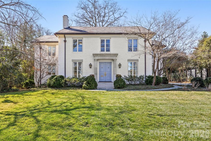 Exceptional high-end Eastover residence offers nearly 7,000 square feet of refined living space across the main house and a beautifully appointed carriage house. Extensively renovated to the studs in 2011–2012 by Frank Smith and Knight Residential Group, this home blends timeless architecture with modern luxury. Situated on prestigious Colville Road on a .44-acre lot, the stately cast stone entry with gas lanterns opens to a luxurious interior with high ceilings, hardwoods, designer fixtures, and gracious formal spaces. Spacious family room opens to the gleaming chef’s kitchen with marble countertops, large island, high-end appliances, scullery, and sunny breakfast room. The main level Primary Suite impresses with custom walk-in closet and marble bath with soaking tub. The upper level offers four en-suite bedrooms, bonus room, and office/playroom. The finished basement adds a rec space and full bath. The carriage house (added in 2021) includes flexible living spaces, a full kitchen, bedroom, two full baths, and laundry—ideal for guests or home office. Covered porch with automated screens looks over the flat landscaped yard, offering year-round outdoor living. The house has a whole house generator also.  Truly a one-of-a-kind home in one of Charlotte’s most sought-after neighborhoods!