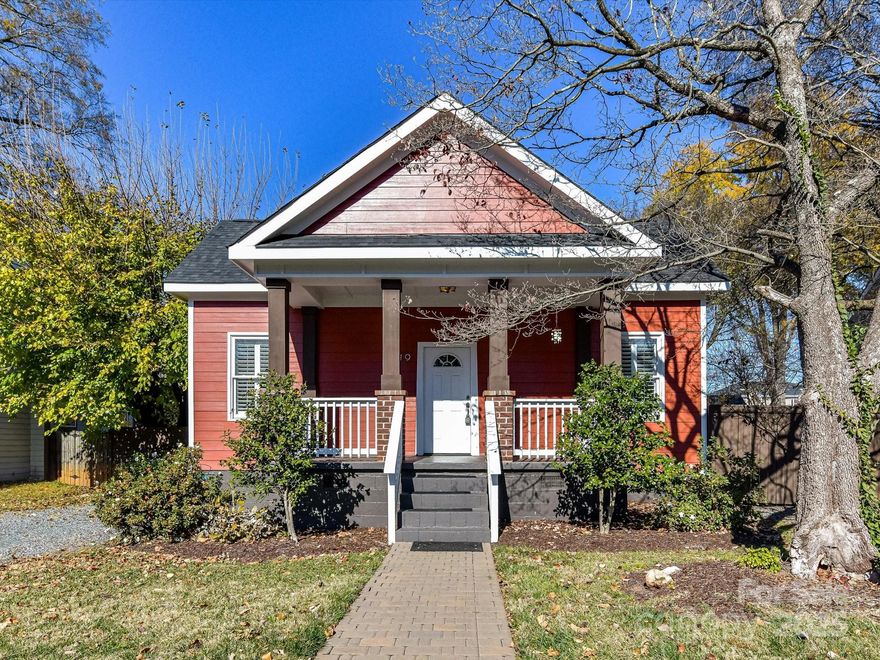 This charming bungalow sits tucked away from the buzz yet only moments from NoDa's shops and restaurants. A classic rocking-chair front porch sets the tone, welcoming you into a bright, open, and thoughtfully updated 3-bed, 2-bath home. Originally built in 1926 with a seamless 2005 addition, the home blends historic character with modern convenience. You’ll find hardwood floors, neutral finishes, and soaring 10-ft ceilings throughout. The updated kitchen features timeless cabinetry and granite countertops, while the primary bathroom offers stylish tile, a relaxing soaking tub, and a spacious frameless shower. Just off the living room and perfect for effortless entertaining, enjoy a side deck ideal for grilling and a screened-in back porch overlooking a flat, private backyard—your own outdoor escape. All bedrooms include custom closets by Closets by Design, and the plantation shutters add a polished finishing touch. With major updates like 2019 HVAC, 2022 roof and 2022 water heater, this home is truly move-in ready!