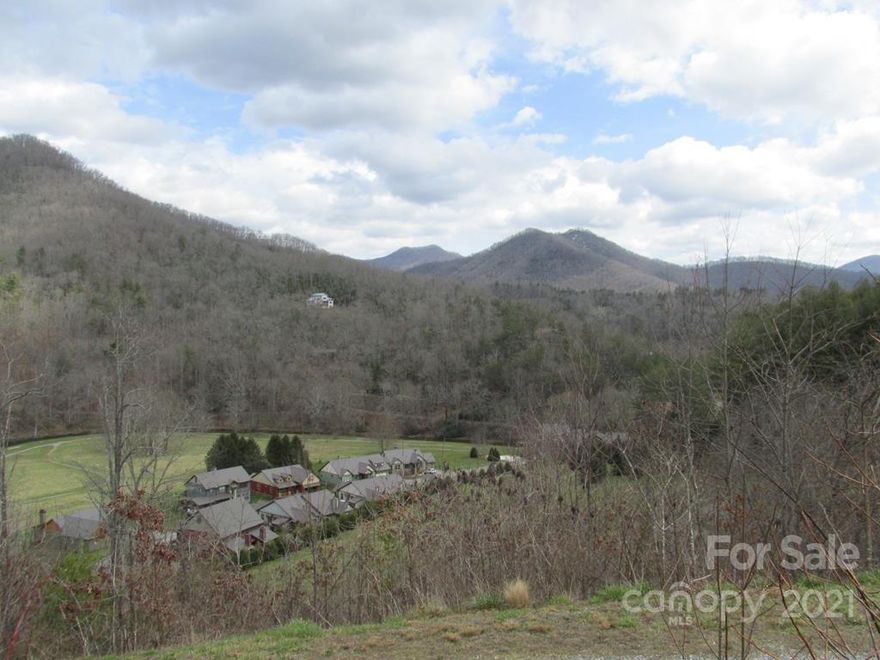 Ready to build lot in Sundrops on Caney Fork! Only available lot with a 360-degree view. Overlooking Caney Fork Creek and the sprawling meadow, near the gated entrance. Community provides water, trash pickup, gate and road maintenance, an infinity pool, hot tub, workout room, a community garden, orchard, walking trails, and access to private areas of Caney Fork Creek for fishing and tubing. Priced below tax value!