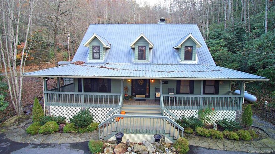 12+ acres of Beautiful park like setting welcomes you to this private paradise! Sounds of rushing water come from your very own waterfall as it cascades down to the pond! Multiple foot bridges cross the creek up to the waterfall & adjacent to the outdoor living area/some covered porches that wrap around the house. 3 bedrooms, 2.5 baths, lg inviting foyer, living room w/built in, gas log fireplace, vaulted ceiling, pass thru to the lg country kitchen & formal dining w/bay windows,