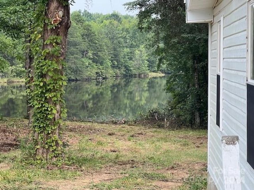 Beautiful private land with pond access.  Pond is shared with neighbors and there is a shared drive. There is a double wide on the property that faces the pond that will need work but could be used as rental or lived in . Very rare to find 12 acres this secluded.  Does have some fenced pasture and lots of room to enjoy nature.  Land is at the end of the long drive that is shared with a connecting 13.89 Acre parcel 2042 Flat Rock Rd, that is also being sold. This is your chance to own 12 or 25.89 acres total with a mobile home on each.  The fish are biting so come check this out before it gets gone.