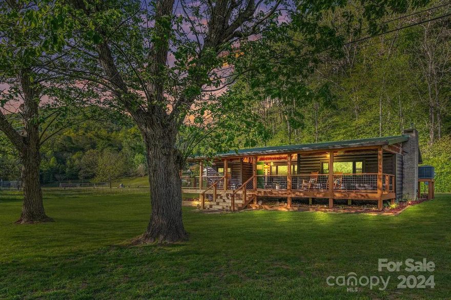 Your mountain escape awaits! Recently renovated and fully furnished vacation rental cabin with no deed restrictions or HOA, nestled alongside a bold trout-filled creek. Enjoy main-level living with an expansive great room featuring a gas-log fireplace and adjoining dining area. The kitchen boasts granite countertops, stainless appliances, and ample cabinet space. Two bedrooms, a full bath, and a convenient half bath complete the main level. Relax on the screened rear porch with a private hot tub, or unwind on the full-length covered front porch, listening to the soothing sounds of the creek. The large flat yard offers a firepit, storage building, and space for RV parking, gardening, and outdoor play. With easy motorcycle-friendly access and just 10 minutes from Bryson City, this is the perfect mountain retreat for both relaxation and adventure!