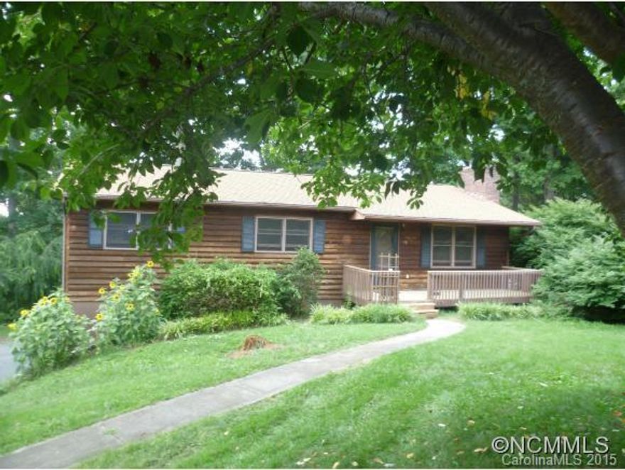 Quiet living in West Asheville. Country vibe, but close to schools, shops & restaurants. Solid home w/open floor plan has much to offer for the price. Cozy up to the fireplace, hang out on the covered back porch w/ mountain views. The large fenced-in back yard is perfect for pets, children or garden. The double garage would make a great studio or workshop. Downstairs is finished w/ bath & separate entrance. Great cozy home or profitable rental.