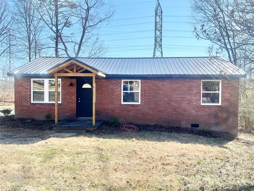 New home buyers, those looking to down size, or investors - this totally renovated brick ranch home on a cul-de-sac lot is ready for its new owner.  The following items are all new: metal roof, HVAC and ducts, water heater, LVP flooring, vinyl windows,  entry doors, kitchen cabinets with granite countertops, fixtures,  shelving, interior paint and trim, stainless steel appliances, crawlspace insulation and ground cover, metal awnings over both entry doors, and a fire pit area in the back yard.  The driveway has fresh gravel that leads to a two space carport, and the septic tank has just been pumped and serviced.  The bathroom features a tile shower and tub combo, and the kitchen and common area have been opened up to create more space.  Come and check it out!