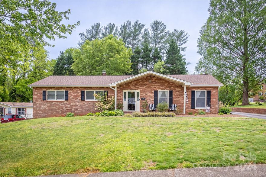 Fantastic opportunity to own a one-level Ranch-style home in Downtown Morganton. This home offers spacious rooms and one-step entry into the home. Upon entry, note the open concept living and dining area off the large eat-in style kitchen. The kitchen offers a large open dining space, plenty of cabinets, and stainless steel appliances. The primary bedroom has a fully updated bath with a quartz vanity. Off the kitchen, you will love the large laundry room with sink, cabinets, storage, and washer/dryer. Spread out and entertain in the all-weather room with large windows and a vaulted wood ceiling that overlooks the backyard. Enjoy easy maintenance with full brick, level lot, and almost all luxury vinyl plank hardwood flooring. The full unfinished basement houses the two-car garage, workshop area, an extra room, and tons of storage! The property to the back LEFT-hand side could also be purchased for $164,900 (112 A Pine St.). Ask the listing agent for details.