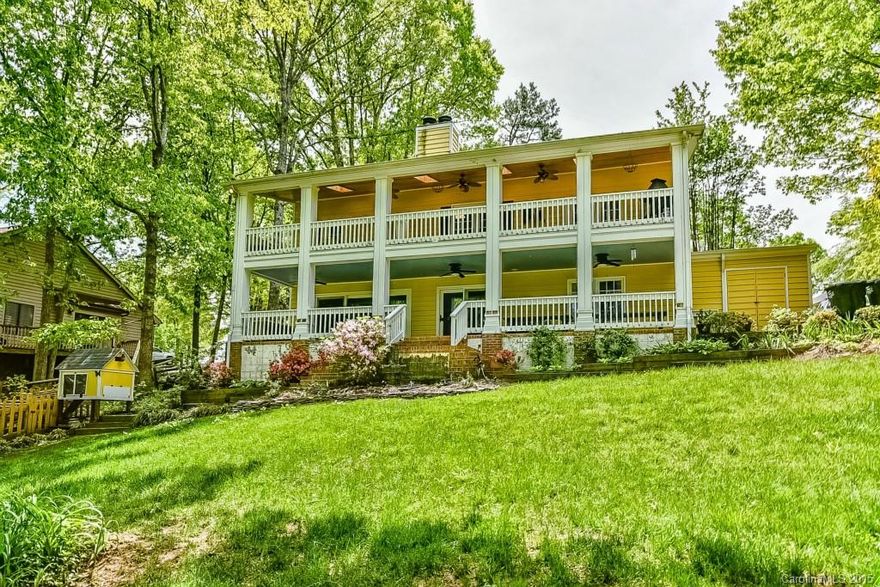 Live the waterfront lifestyle to the fullest w/awesome covered porches overlooking large lawn, water & dock. Waterfront perfection w/master & office on top level, privately tucked away from the lower level rec room, secondary bedrooms & huge utility/storage area. Main flr offers a spacious great room w/hardwood flrs & superb kitchen w/5Star gas range w/grill, silestone countertops & stainless appliances. Lower flr offers 2nd fireplace, wet bar, custom shelving, a wall of windows & more!