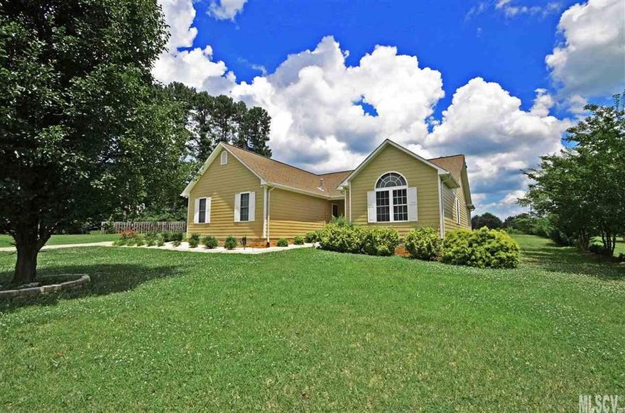 Pristine home with new laminate floors in kitchen as well as a pantry & new appliances: electric stove (convection), microwave, dishwasher,as well as a refrigerator.  All 3 bedrooms are oversized and provide plenty of personal space and each have ceiling fans.  The master bedroom has a very large walk in closet and the master bath has a jetted tub, separate stall shower, and his/ her sinks.  The living room has a gas fireplace,  is very open and flows into the dining area. In the evenings you can enjoy sitting on the deck that overlooks a very level back yard or go for a walk around the quiet neighborhood. Seller says attic has some floored storage.