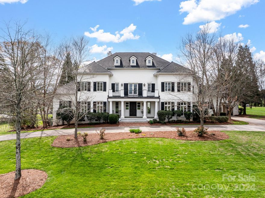 This prestigious 7 BR Estate sits on 2 beautiful Acres in Arbor Oaks! Custom Built by Simonini in this gorgeous gated community, this home is appointed with elegance and class rarely seen anymore! You must see the new kitchen by Vanderloc including scullery, fabulous pantry and fantastic laundry/utility area. Nanny/guest quarters, massive bonus room, custom pool with slide, spa with spillover, rain curtain, all surrounded by fabulous brick decking. Beautiful brick terrace on main and lower levels perfect for entertaining, enormous backyard and side yards for privacy and recreation, upper walk out balcony with long range view, master on main with huge walk in closet and bathroom that features a euro-style shower and heated floors, his and her vanities and toilets! PLUS the lower level features theater/rec room, Custom lit Gym, sauna and plunge pool and even a dance floor! Perfect location just off I-85 with quick access to uptown Charlotte and Charlotte Douglas airport.