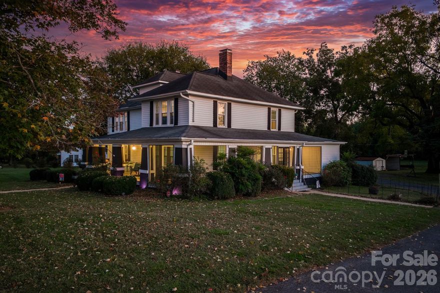 MAJOR PRICE DROP! Positioned for opportunity, this residential property offers strong development and rezoning potential. Seller is open to a short inspection period to support buyer-led rezoning exploration. Timeless farmhouse charm meets modern sophistication on 1.55 acres! This 3,417 sq-ft home beautifully blends character and comfort, offering 3 bedrooms, 2 bathrooms, and two versatile bonus rooms on the upper level. Step onto the inviting wrap-around porch and into a home that’s been thoughtfully renewed while preserving its vintage appeal. Inside, you’ll find porcelain tile floors (2018) complementing original hardwoods, custom built-ins, and two cozy fireplaces that add warmth and charm. The spacious kitchen offers abundant storage, new stainless steel appliances (2023), and a stunning Calico Perez quartz island (2024) — perfect for gathering and entertaining. The primary suite features a luxurious tiled walk-in shower, dual-sink vanity, garden tub, and generous walk-in closets, while the secondary bathroom impresses with a fully updated tiled bath/shower combo and modern finishes. Major updates include new windows with a lifetime warranty (2018), sump pump in basement (2025), updated plumbing, electrical, and HVAC (2018), and a septic tank pumped in June 2025. Outside, enjoy the 10x12 she-shed — ideal for hobbies, kids play area, or extra storage — and the tranquility of country living just minutes from I-40, shopping, dining, and entertainment. A true revamped vintage beauty, this home seamlessly combines modern upgrades with timeless character — ready for you to move right in and fall in love.