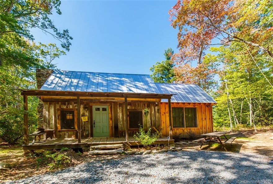 RARE FIND! 13.3 walkable acres with trails, small streams and 3 driveways cut in and the most special mountain cabin imaginable. The central part of the cabin (family room) was once part of a late 1800's cabin at the foot of what is now Connestee. It was taken apart and moved in the 1970's. In 2014 the rest of the cabin was built and added to this structure so all new everything-roof, HVAC, electrical, plumbing, appliances, insulation-you name it! This is truly an enchanted paradise! A must see!