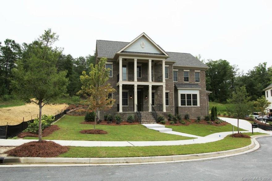 This home has hardwoods and 10' ceilings on main floor. Bright white cabinetry throughout. Granite in kitchen and SS GE Monogram appliances. Formal Dining Room has coffered ceiling while the Master and Office have tray ceilings. Iron Spindles will adorn the stairway.  Beautiful double Charleston front porches and 3 car garage. Cul-de-sac street.