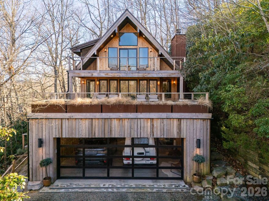 Stunning, Mountain-Modern Retreat in the Private, gated enclave of Connestee Falls. Completely renovated in 2023, this 3 bed/3 bath, Post & Beam construction home features all new Plumbing, Electrical, and HVAC ductwork, Kitchen-Aid & Fisher-Paykel appliances, Soapstone and Marble Countertops, European White Oak Flooring & Cabinetry, natural Cedar-wood cladding, exposed beams, Floating Stair-Cases, and a Wood-Burning, Stone Masonry Fireplace. Open Floor-Plan Kitchen and Dining, with one guest room on the Main Floor along with a full bath and a separate Mud-Room Entry with Butler's Pantry & Laundry.  Primary Suite on upper level features Walk-In Closet, en-suite Bath with dual vanity, dual rain-head shower, and large private, outdoor balcony for enjoying the long-range Mountain Views.  Additional Guest Room Upstairs with en-suite Bath. Attached, 2 car garage addition also features a rooftop terrace with pet friendly artificial turf.  Over 1,800SF of all cedar decking & outdoor living space for enjoying the beautiful Summer and Fall months that Western North Carolina has to offer.  Enjoy the use of 4 private lakes within the Community as well as world-class hiking trails and amenities including brand new fitness center, excellent on-site dining options, Pickleball, Golf, Tennis, and heated Pool. Furnishings are negotiable. Owner is agent. Home has community Water & Sewer, and High Speed Internet.