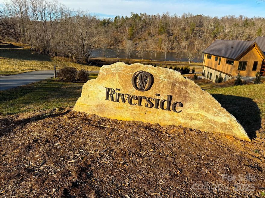 If you’re looking for a place that combines stunning river views with a vibrant, community-oriented lifestyle, this lot might be your perfect match! With its location offering unobstructed views of the French Broad River, you’ll be able to enjoy the scenic beauty right from your new home. Being part of the Olivette Riverside Community means you'll have access to an array of amenities and activities. The riverside pavilion and park are just steps away, where you can join in on live music events, farm-to-table dinners, and neighborhood potlucks. The community is also known for its sustainability and focus on local living, featuring a large farm with goats, flowers, fruits, and vegetables. The neighborhood spans 411 acres and includes 8 miles of trails, a dog park, a labyrinth, a river park with a pavilion, and even a private island. Plus, it’s just a 20-minute drive to downtown Asheville, providing the perfect balance between serene, rural living and urban convenience. Property did not flood from Helene.