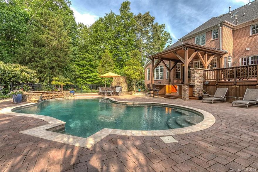 AMAZING James Custom Home w/ upgrades throughout & millwork.  Beautiful Backyard & POOL, stunning Full OUTDOOR KITCHEN, OUTDOOR FIREPLACE, Patio, Deck, Landscape.  6 BR, or 5 BR/Bonus w/bth w/add'l bonus rm.  5 1/2 baths.  Open plan w/Stone FP in Great Rm & Gorgeous SUNROOM w/wetbar.  BR & full bth down, & powder rom. Kitchen w/granite, SS app, incl refrig, new DW, dbl oven, recessed cooktop, dbl pantries & Butler Pantry. Plantation Shutters. Central Vac. Jetted tub. Dual Stairs.  Move-in Ready!