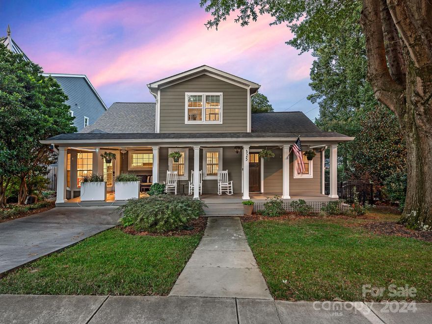 Welcome to 325 McDonald Avenue! Enter this charming Dilworth bungalow from the rocking chair front porch. The home features a large, modern kitchen with white and gray cabinetry, an eat-in island, quartz countertops, and stainless steel appliances. The sunny living space has ample windows and French doors that lead to the back deck. The spacious primary suite on the main floor features dual vanities, a large soaking tub, a shower, and a water closet. There is also a second bedroom with an ensuite bathroom on the main level. The second floor boasts a huge bonus room, two additional bedrooms, and a full bathroom. The backyard provides the ultimate entertaining space with a tiered deck overlooking the beautiful pool featuring an integrated spa and baja shelf with seating. There is also a detached two-car garage with ample storage space. You can easily walk to everything that SouthEnd and Dilworth have to offer from this wonderful location.