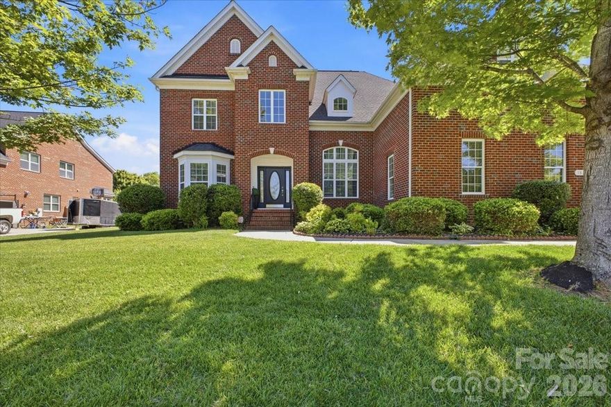 This Highland Creek home checks the boxes for space, flexibility, upgrades, and lifestyle. Offering 3,440 square feet with 5 bedrooms and 4 full bathrooms, the floor plan includes a main-level bedroom and full bath, a dedicated main-level office, and multiple living areas designed for everyday convenience and entertaining.

The kitchen features white cabinetry, granite countertops, a wine cooler, and an open connection to the main living spaces. Upstairs, the primary suite offers a tray ceiling, walk-in closets, soaking tub, and separate shower. One of the bedrooms is currently designed as a spacious home theater, creating a memorable entertainment feature with nearby bathroom access and storage.

The outdoor space adds another major highlight. Enjoy a covered composite deck, backyard TV/speaker setup, sprinkler system, retaining wall, and multiple fruit trees, creating an inviting setting for outdoor dining, gatherings, or quiet evenings. Inside, surround sound in the living room and game/media areas adds to the home’s entertainment-ready feel. The side-entry 3-car garage with epoxy flooring provides excellent space for vehicles, storage, hobbies, or fitness use.

Highland Creek is known for its extensive amenities, including 4 pools, parks/playgrounds, 2 clubhouses, fitness center, tennis/pickleball courts, fishing areas, walking trails, and community events. Nearby public golf and sports club amenities add to the area’s appeal. The location offers convenient access to shopping, dining, Concord Mills, and major routes including I-85 and I-485. With its spacious layout, entertainment-ready features, outdoor living, and amenity-rich setting, this home is a strong opportunity in Highland Creek.