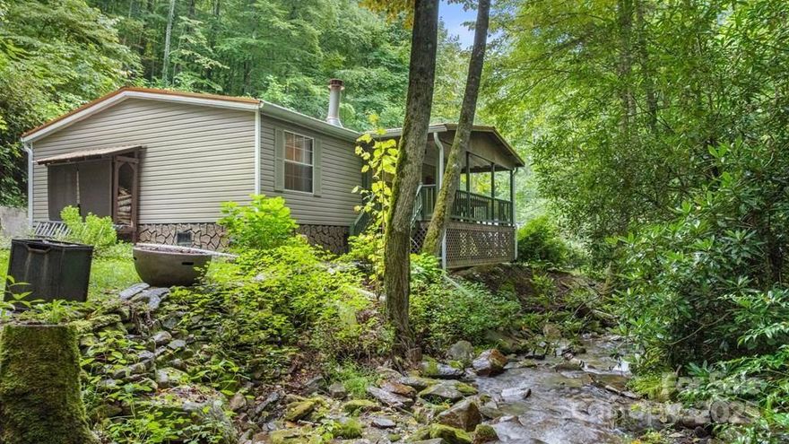 Creekside Getaway on Dicks Creek. Enjoy peace and privacy in this immaculate 3-bedroom, 2-bath home with a brand-new kitchen. A separate studio with loft adds flexibility for guests or creative space. Beautifully landscaped, with Dicks Creek flowing right in front—perfect for relaxing on the porch or in the yard to the sound of rushing water. A must-see retreat!