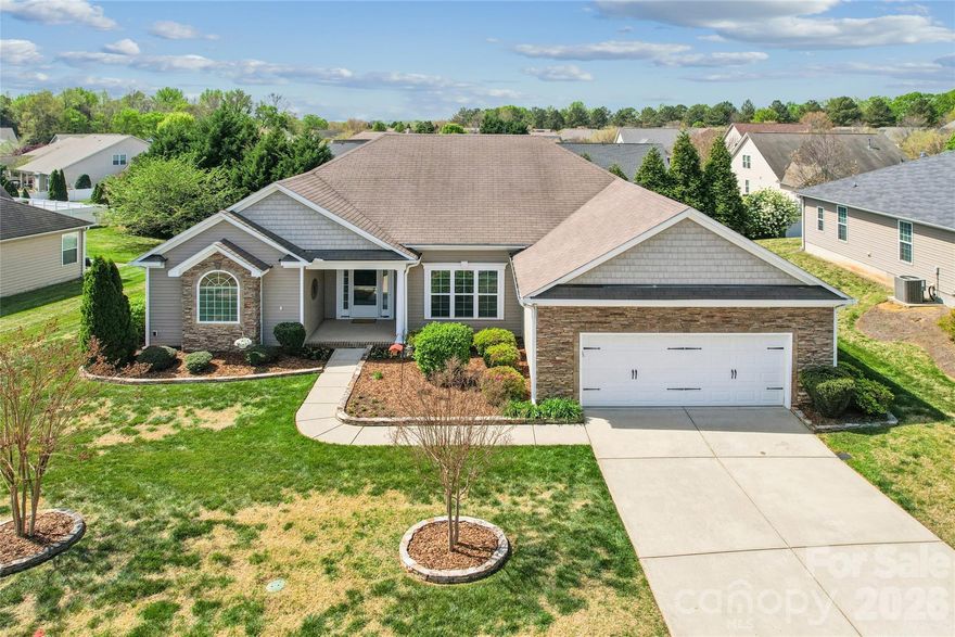 This charming ranch-style home in the highly sought-after Laurel Park community offers the perfect blend of modern upgrades and effortless single-level living. Whether you're entertaining or enjoying a quiet evening, 2632 New Haven Street is designed to impress. Modern Comfort meets Classic Style! 
Step inside to find a spacious split-bedroom floor plan that prioritizes privacy. The home features stunning hardwood flooring throughout all main living areas and bedrooms, providing a seamless and high-end feel. Chef-Inspired Kitchen: The heart of the home boasts granite countertops, a large kitchen island with a seating bar, and a stylish tile backsplash. High-quality Frigidaire Gallery stainless steel appliances, including a gas stove, make meal prep a delight. Inviting Great Room: Relax by the cozy gas fireplace, perfect for chilly North Carolina evenings. Primary Suite & Guest Wings: The split layout ensures the primary suite remains a quiet retreat, away from the secondary bedrooms. The Exterior: Your Private Oasis! The outdoor living space is a standout feature of this property, offering multiple areas to enjoy the fresh air. Outdoor Living: Choose between the shade of the covered porch or the open-air separate patio—ideal for grilling or fire pit sessions. Privacy & Storage: The backyard is fully enclosed with a privacy fence, making it perfect for pets or play. The garage includes a dedicated storage area to keep your tools and gear organized.