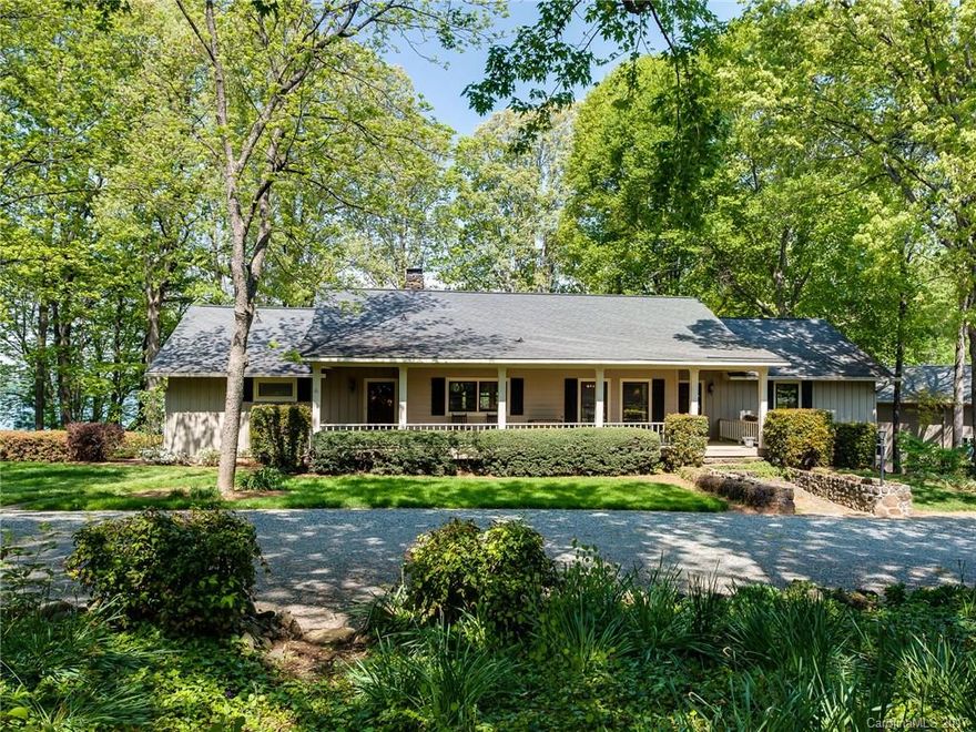 Upper Jetton waterfront home full of charm & local history, perched on approximately 1.18 acres of prime Lake Norman real estate. Heart pine floors, custom kitchen brickwork, bright sunroom, 2 bar areas, huge stone fireplaces on each level and rocking chair front porch beckons one to stay for a while. Mature hardwoods compliment sprawling landscaped grounds complete w/stone outdoor fireplace & Koi pond. Newly renovated covered dock, huge new "barn" w/enough room for even the largest RV. Sweet!