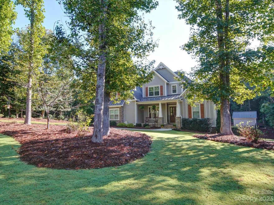 Autumn Woods is a beautiful community with spacious homes and large lots in East Lincoln, minutes away from Denver, NC and Lake Norman. This custom home sits on a private 1.5 acre lot with an in-ground pool and covered pool house. The beautifully landscaped property showcases the path to the pool where you can relax and unwind.  The pool house features a bath, outdoor shower, mini fridge and is wired for media. The open floor plan of this home is very warm and inviting. Built in cabinets by the fireplace, wood flooring and trim details throughout the home are just a few of the features. A large screened porch is perfect for relaxing and enjoying the breeze. The kitchen has plenty of cabinets, large island, walk in pantry, dining area and drop zone. Large primary bedroom on the main level,  walk in closet, soaker tub and stand alone shower. You or your guest can enjoy the extra spacious bonus room for movies, games or entertaining. Don't miss the large walk in storage  under the house.