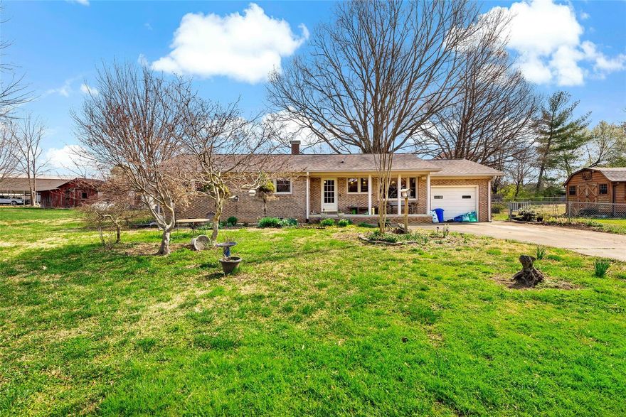 Come home to this charming brick ranch in a great neighborhood between Lake James and Marion.  The lovely, mature landscaping of Japanese maples, hosta plants, fig and pear trees, and blueberry bushes greet you with amazing curb appeal, while the traditional features of a 3 bedroom/2 bathroom will provide easy one-level living. This property is ideal for a gardener/homesteader with the bonus additions of your very own greenhouse, barn, chicken coop, and storage shed.  The kitchen offers updated features such as granite countertops, cherry cabinets, tile floors, tile backsplash, and stainless steel appliances. Enjoy your morning coffee in the enclosed sunroom or the adjoining patio, which overlooks the fully fenced back and side yards.  A new heat pump and water filtration system were added in 2022. Schedule your visit today to see why you want to make 508 Riverbend Drive your next home!